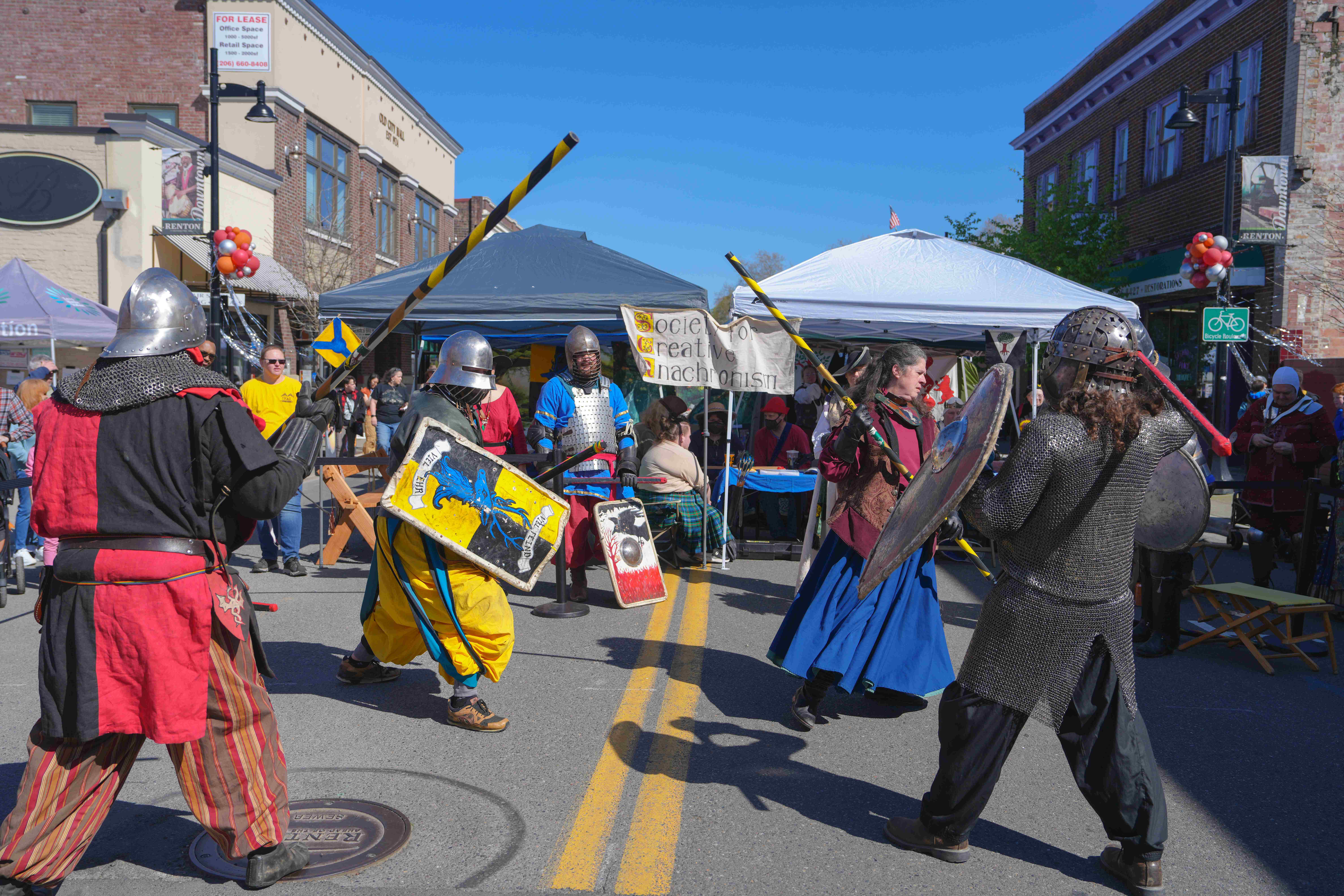 Four people josting during dragon's landing celebration