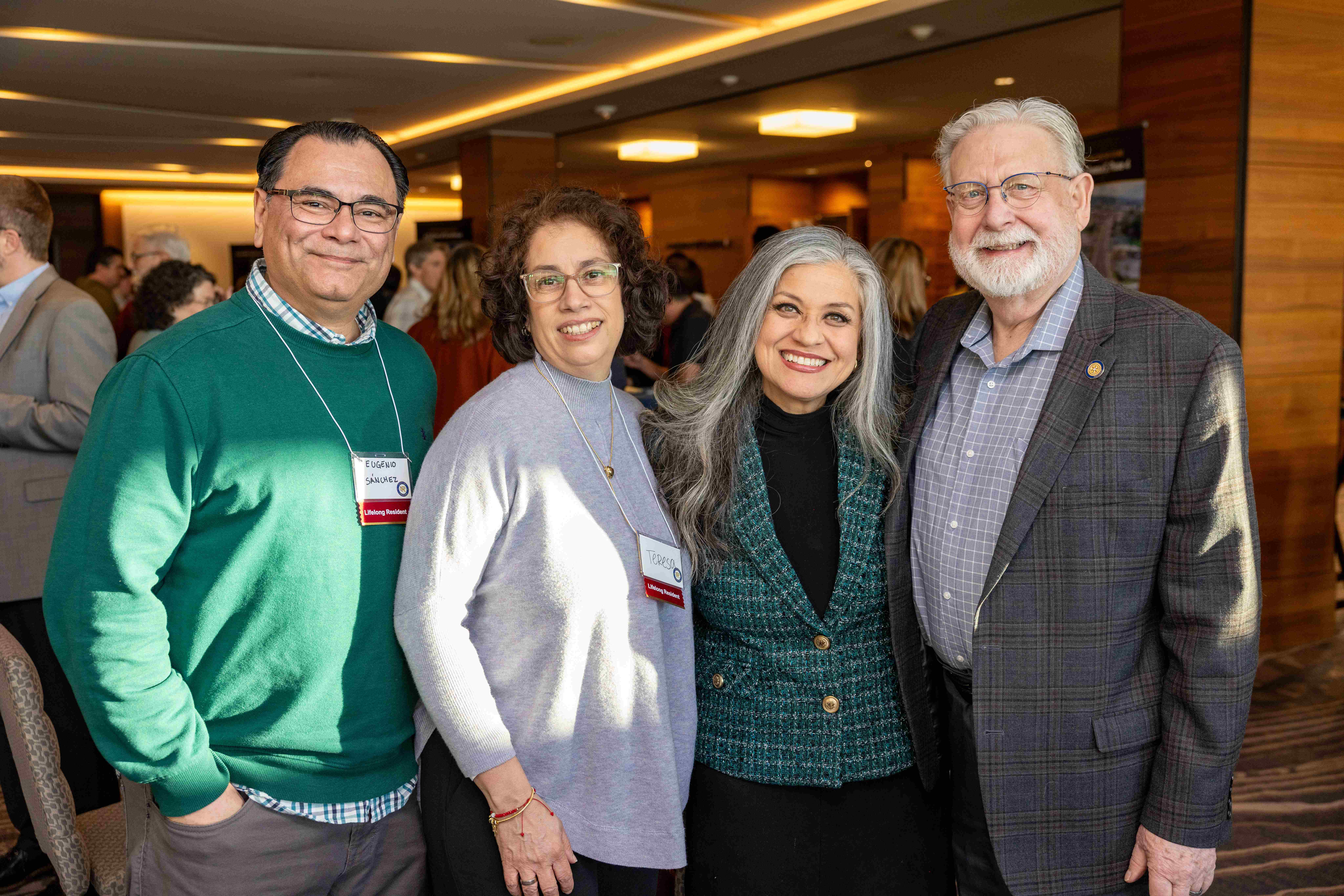 Council President Ruth Perez taking photo with husband and community members