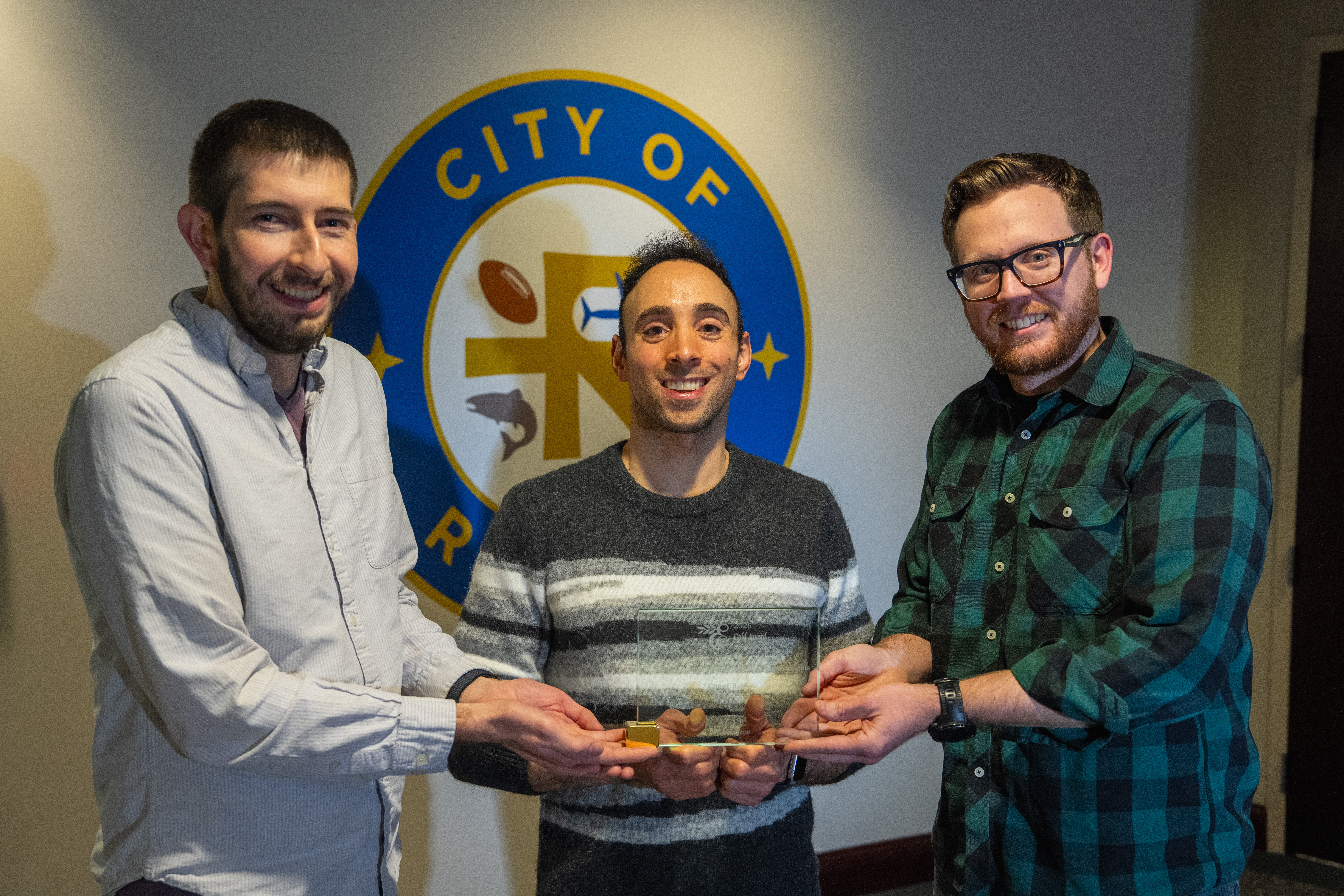 2026-Stormwater-Award-group-photo-presenting-the-award-in-front-of-City-of-Renton-logo.jpg
