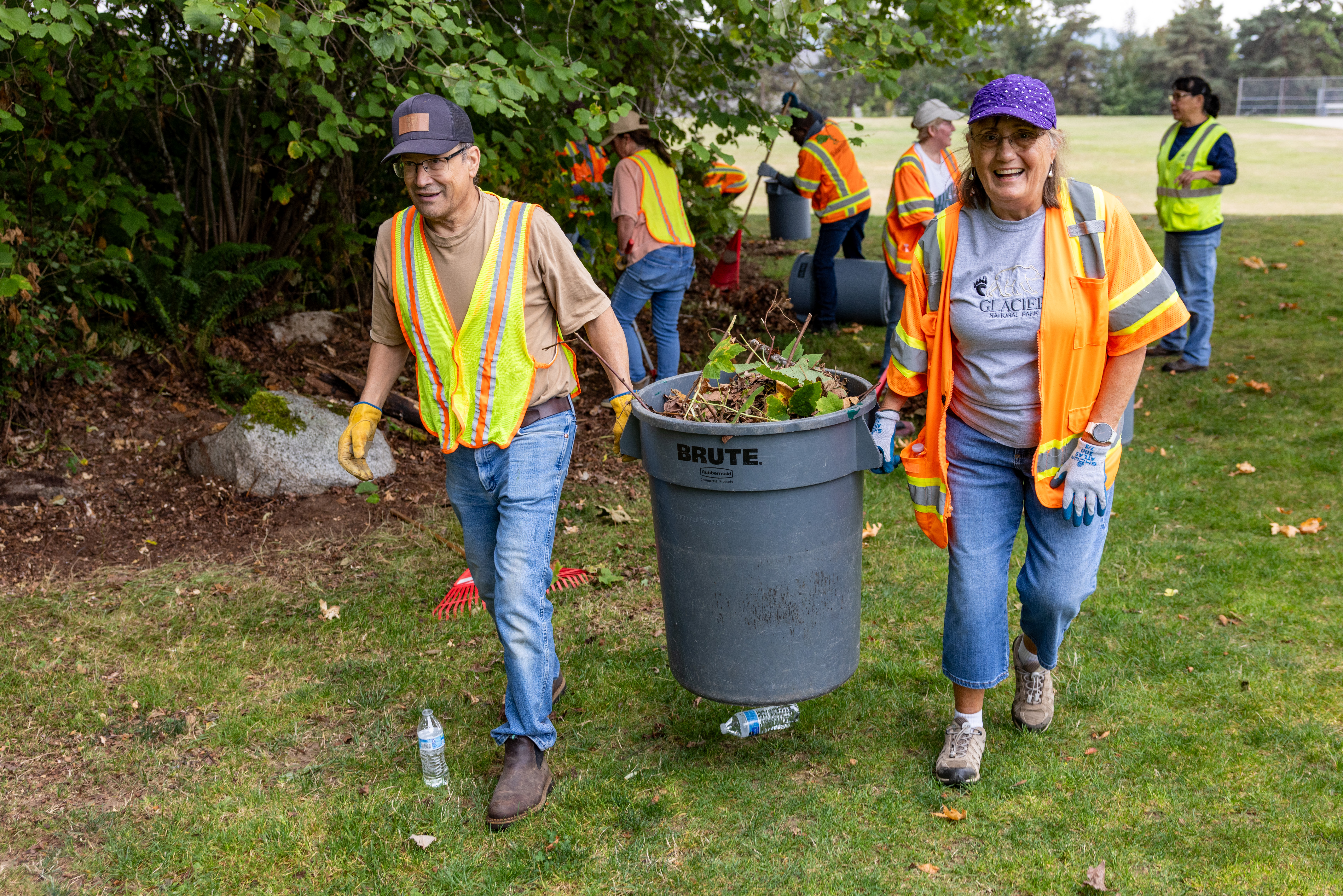 Two-volunteers-carrying-a-can-of-debris-at-a-Parks-clean-up-event-City-of-Renton-park.jpg