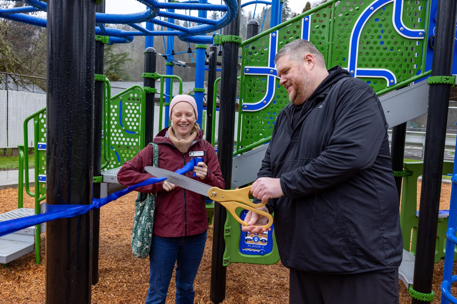 Parks-staff-cutting-the-ribbon-at-Maplewood-Playground.jpg