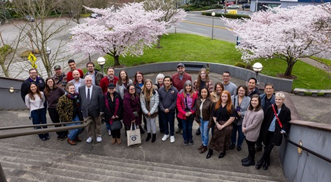 Renton-Civic-Academy-graduation-photo-in-front-of-cherry-blossoms-at-Renton-City-Hall.jpg