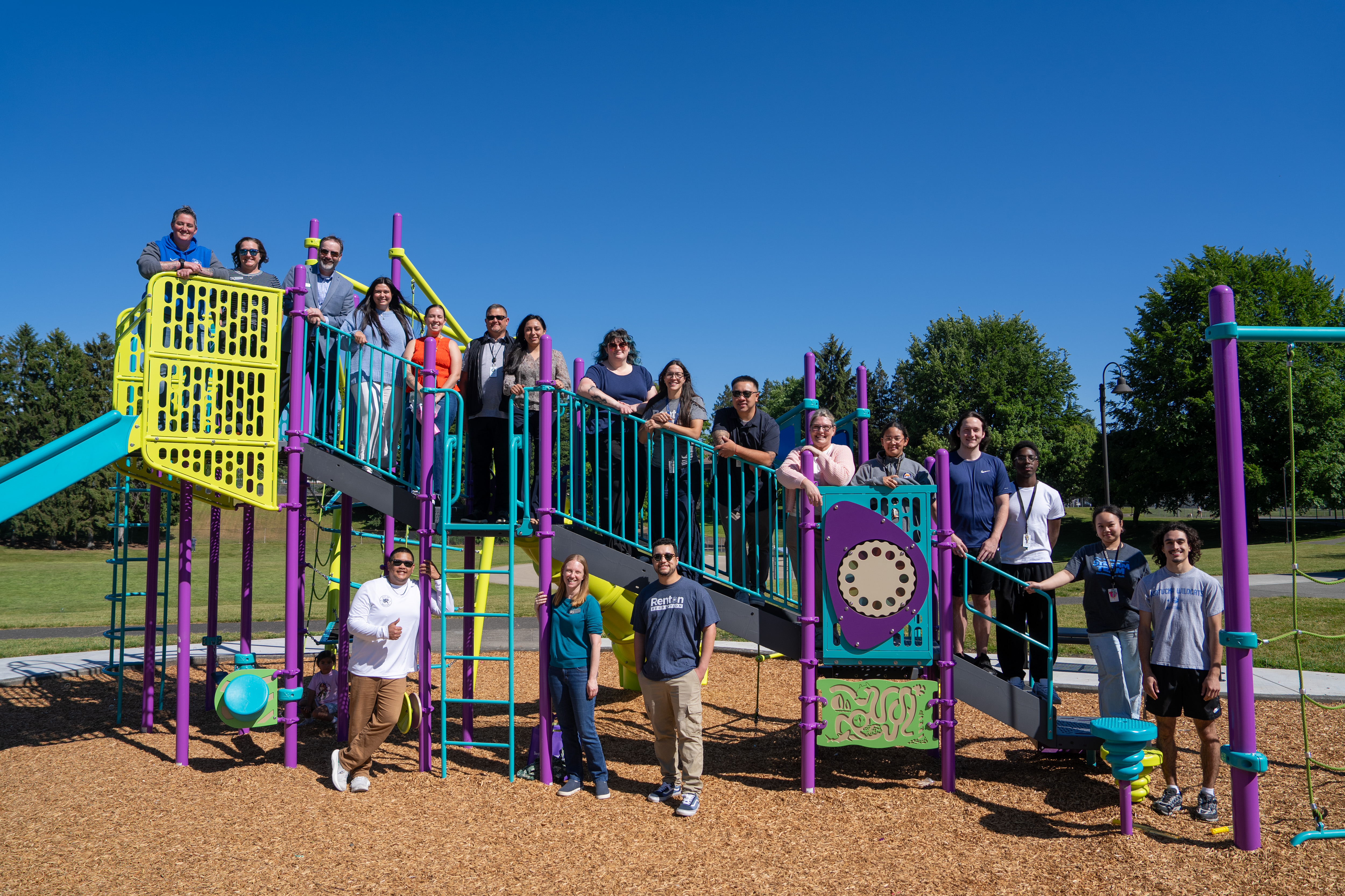 Parks-and-Recreation-staff-on-the-new-Highlands-Playground.jpg