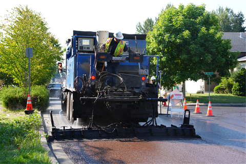 Slurry-Seal-vehicle-applying-it-to-the-road.png