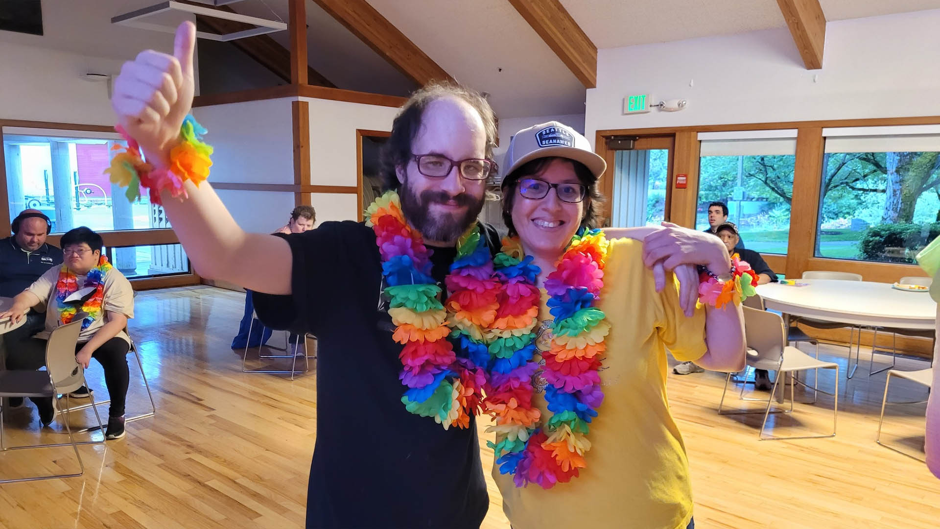 Adaptive Recreation participants wearing colorful leis at a dance