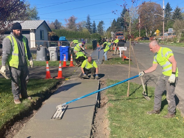 crews paving sidewalk