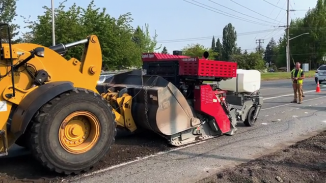 Paver smoothing out concrete