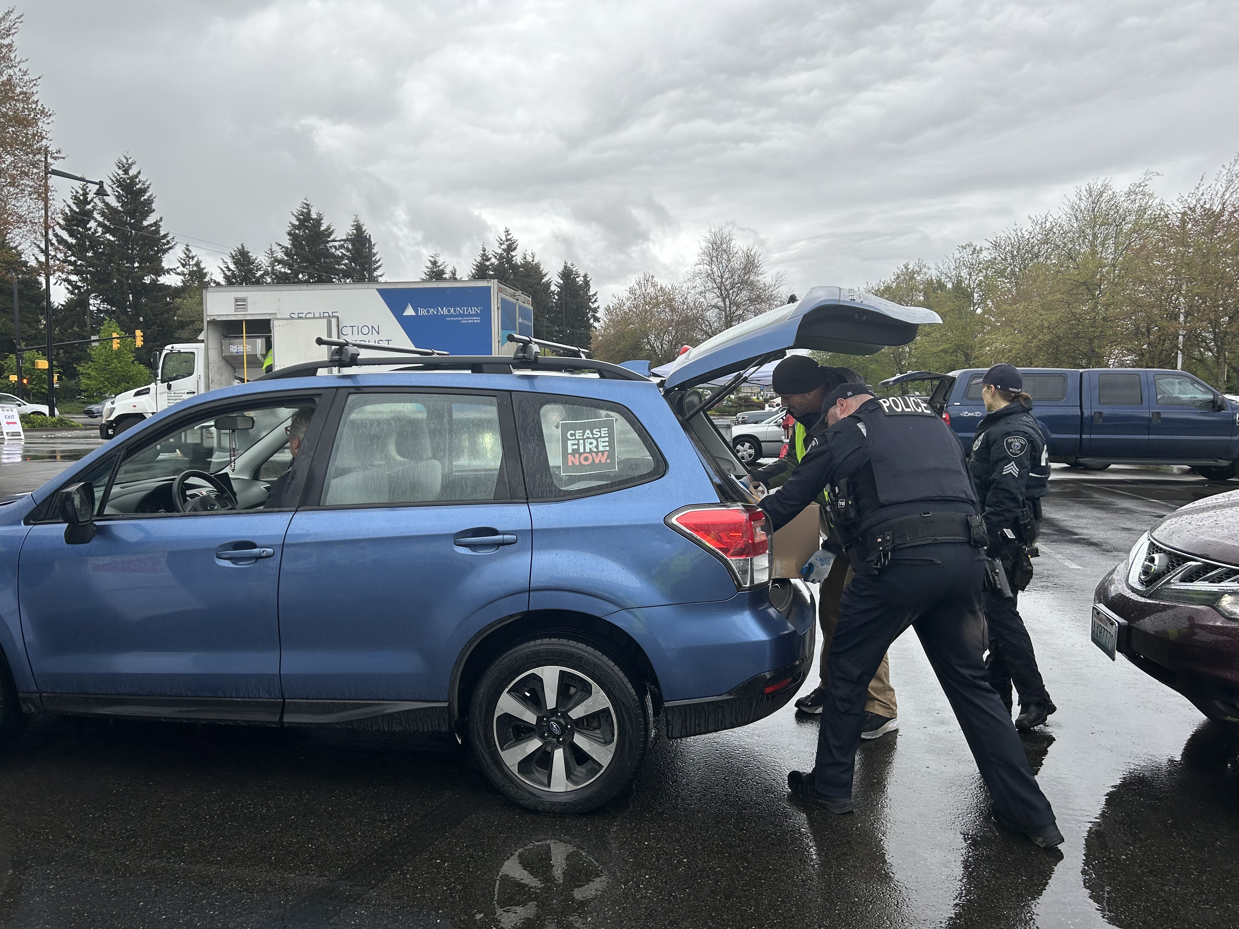 officers loading car